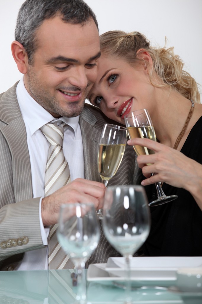 Formal couple toasting their anniversary