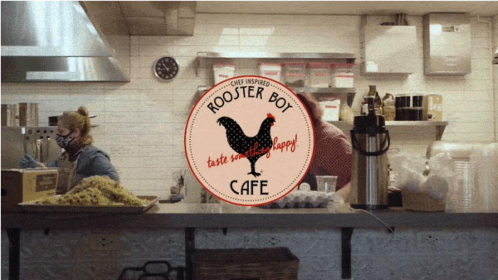 Rooster Boy Cafe image with Chef Sonia in the kitchen